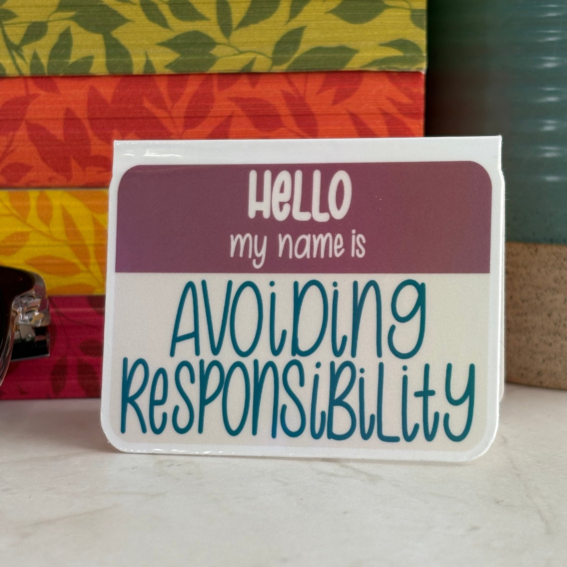 Magnetic bookmark with text 'Hello my name is Avoiding Responsibility' on a colorful background